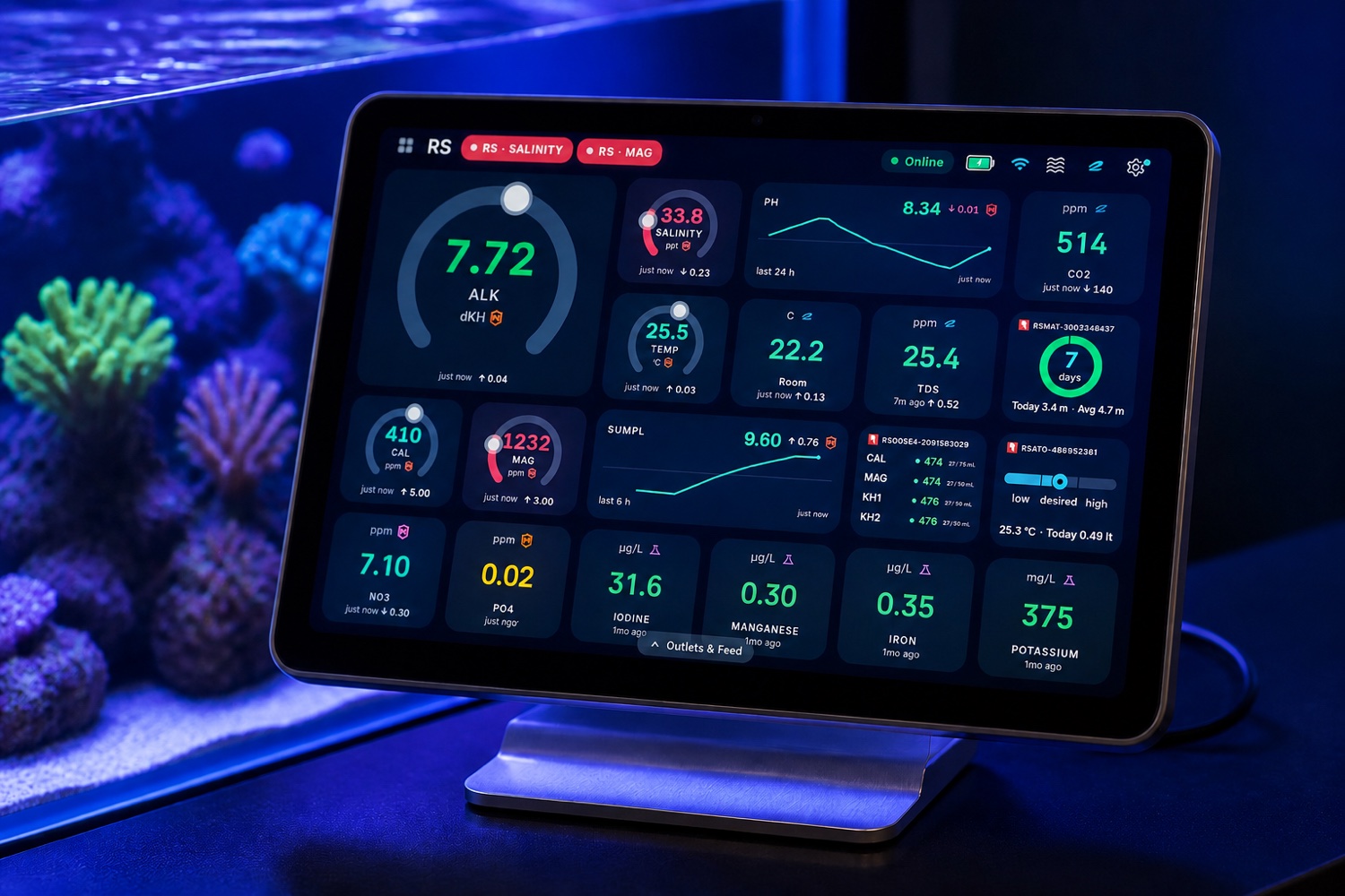 Cora Max command center displaying a live dashboard beside a reef aquarium